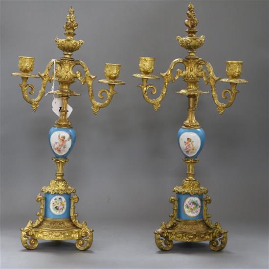 A pair of Sevres style porcelain and gilt metal three branch candelabra overall height 46.5cm